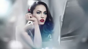 Beautiful Megan Fox Applying Red Lipstick In The Mirror Wallpaper