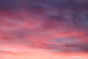 'beautiful Pink And Gray Ombre Clouds Against A Clear Sky' Wallpaper