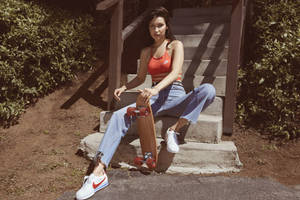 Bella Hadid Sitting With Skateboard Wallpaper