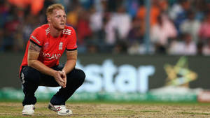 Ben Stokes Resting On The Field Wallpaper