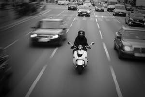 Bike Rider Speeding Through A Highway Wallpaper