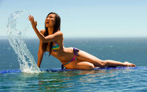 Bikini Girl Splashing Water Wallpaper
