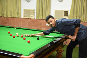 Billiards Man With Pool Stick On Pool Table Wallpaper