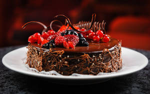 Birthday Cake With Decadent Fruit Toppings Wallpaper