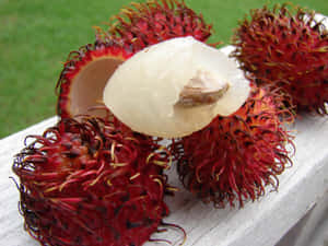 Bite Of Ripe Pulasan Fruits Wallpaper