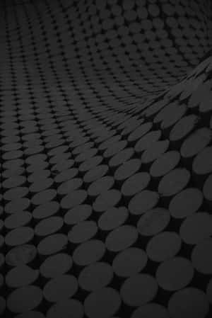 Black And Gray Carpet With A Circle Pattern Design Wallpaper