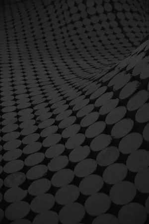 Black And Gray Carpet With A Circle Pattern Design Wallpaper