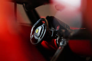 Black And Red Ferrari Steering Wheel Selective-focus Photography Wallpaper
