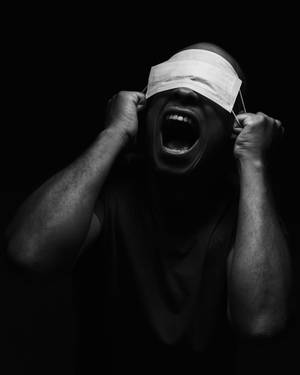 Black And White Portrait Of A Man With A Mask Wallpaper