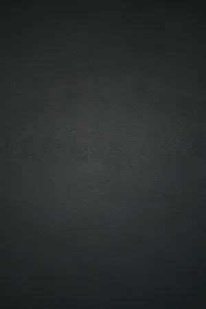 Black Concrete Wall Background With A Light Reflection Wallpaper