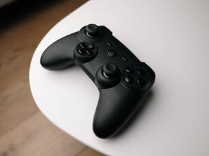 Black Joystick On Table Wallpaper