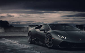 Black Lamborghini Dark Skies Wallpaper