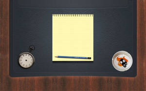 Black Leather Envelope On Office Desk Wallpaper