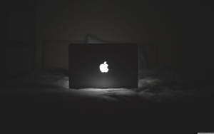 Black Macbook Laptop - Ready For Productivity And Creativity Wallpaper