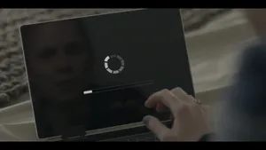 Black Mirror Laptop Displaying Loading Icon Wallpaper