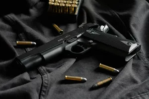 Black Semi Automatic Pistol On Black Textile Wallpaper