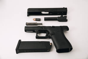 Black Semi Automatic Pistol With Pistol Wallpaper