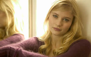 Blonde Woman Contemplative Gaze Wallpaper