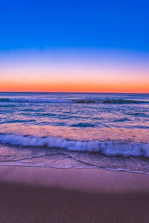 Blue And Orange Sunset Beach Android Wallpaper