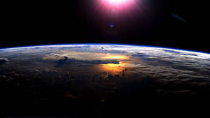 Blue Planet Brightly Lit By The Sun Wallpaper