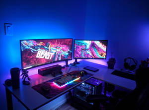 Blue Room With Computers And Desk Wallpaper