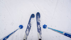 Blue Skiing Board And Poles Wallpaper