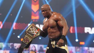 Bobby Lashley Triumphantly Holding Wwe Championship Belt Wallpaper