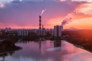 Body Of Water Near City Buildings During Sunset Wallpaper