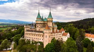 Bojnice Castle Beneath Blue Cloudy Sky Wallpaper