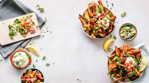 Bowls Of Finger Foods In White Table Wallpaper