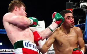 Boxing Star Saul ‘canelo’ Alvarez Delivering A Powerful Uppercut Wallpaper