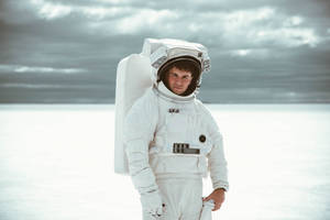 Boy In White Hoodie Standing On Snow Covered Ground During Daytime Wallpaper