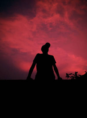 Boy Shadow Against Beautiful Pink Sky Wallpaper