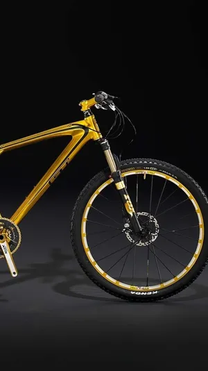 Breathtaking Action Shot Of Mountain Biking Adventure Wallpaper