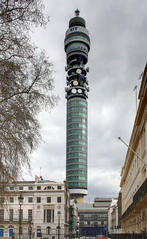Breathtaking View Of The Iconic Bt Tower Enveloped In A Silver-grey Skyline Wallpaper