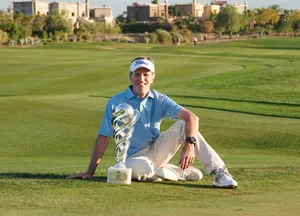 Brett Quigley Sitting With Trophy Wallpaper