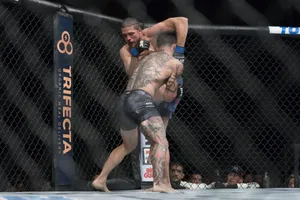 Brian Ortega Arm Over Opponent Wallpaper