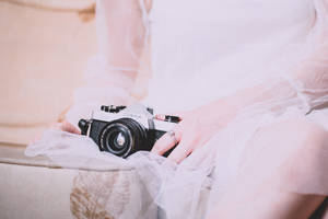 Bridesmaid Capturing Memories With Cosina Camera Wallpaper