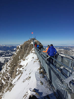 Bridge With Flag On Swiss Alps Wallpaper