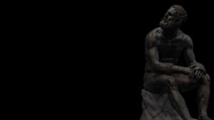 Bronze Statue Thinking Pose Wallpaper