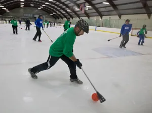 Broomball Green And Blue Sports Players Wallpaper