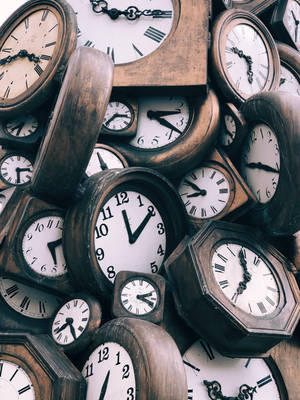 Brown-and-white Clocks Wallpaper