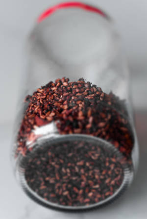 Brown Powder In Clear Glass Jar Wallpaper