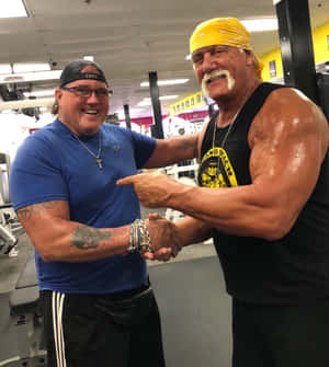 Brutus 'the Barber' Beefcake Alongside Hulk Hogan In Their Prime. Wallpaper