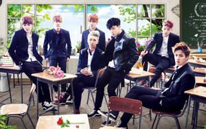 Bts Group Photo In Classroom Wallpaper