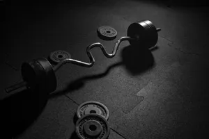 Cambered Barbell And Plates Wallpaper