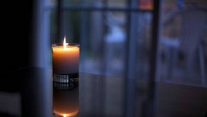 Candle Near The Balcony Wallpaper