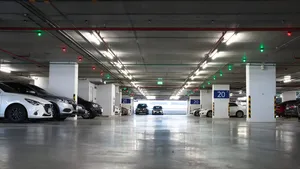 Caption: A Low-angle View In An Underground Parking Garage Wallpaper