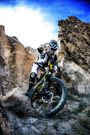 Caption: Adrenaline-packed Mountain Biking Adventure, Viewed From An Iphone Wallpaper