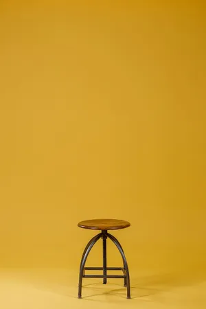 Caption: Aesthetic Wooden Stool Chair Wallpaper